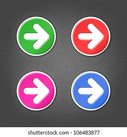 4 colored arrow sign round stickers. Smooth green, red, purple, cobalt internet web button with drop shadow on gray background with noise effect. This vector illustration element saved in 10 eps