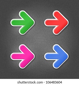 4 colored arrow sign stickers. Smooth green, red, purple, cobalt internet web button with drop shadow on gray background with noise effect. This vector illustration design element saved in 10 eps