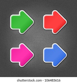 4 colored arrow sign stickers web icon. Smooth green, red, purple, cobalt internet button with drop shadow on gray background with noise effect. This vector illustration design element saved in 10 eps