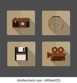 4 icons Camera, headphone, Diskette , Movie Camera ,long shadow on brown background
