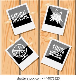 4 images: natural, stub, 100% natural, globe and recycling symbol. Ecology set. Photo frames on wooden desk. Vector icons.