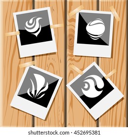 4 Bilder von einzigartigen abstrakten Formularen. Fotorahmen auf Holzschreibtisch. Vektorsymbole gesetzt.
