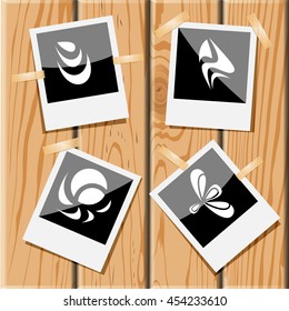 4 images of unique abstract forms. Photo frames on wooden desk. Vector icons set.
