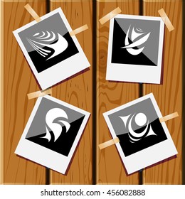 4 imágenes de formas abstractas únicas. Fotografías sobre un escritorio de madera. Iconos vectores establecidos.