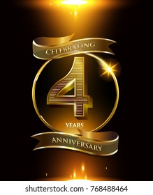 4 years anniversary logo with shiny ribbon and golden ring isolated on black background