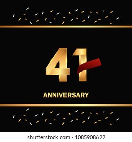 41 gold anniversary celebration design with red ribbon and glitter element, isolated on black background