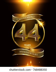 44 years anniversary logo with shiny ribbon and golden ring isolated on black background