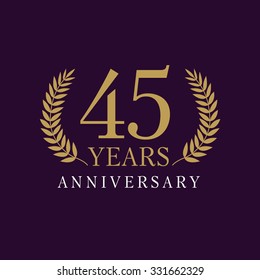 45 years old creative logotype. Congratulating 45th numbers gold colored template framed in palms. Isolated abstract graphic design template. Celebrating tradition banner.
