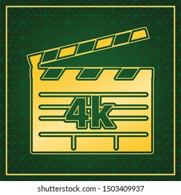 4k film sign. Golden icon with gold contour at dark green gridded white background. Illustration.