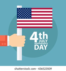 4th of july American independence day greeting card with male hand holding american flag.