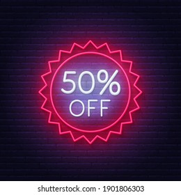 50 percent off neon badge. Discount lighting sign on a dark background.