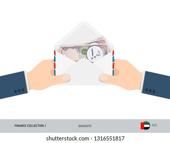 50 United Arab Emirates Dirham Banknotes in envelope hold in hand. Flat style opened white envelope with cash. Salary payout or corruption concept.