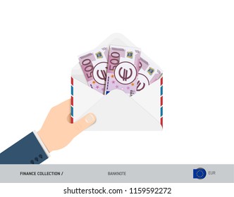 500 Euro Banknotes in envelope hold in hand. Flat style opened white envelope with cash. Salary payout or corruption concept.