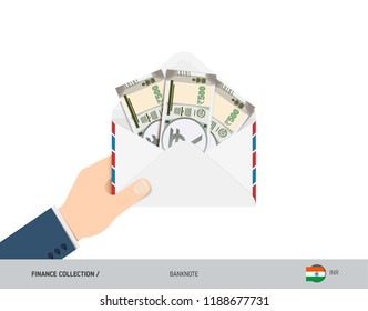 500 Indian Rupee Banknotes in envelope hold in hand. Flat style opened white envelope with cash. Salary payout or corruption concept.