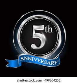 5th anniversary logo with silver ring and blue ribbon.