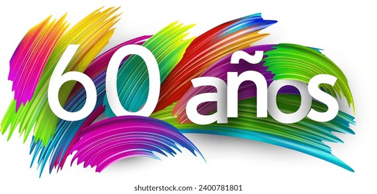 60 years at spanish paper word sign with colorful spectrum paint brush strokes over white. Vector illustration.