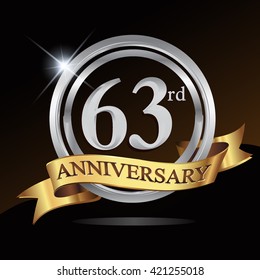 63rd anniversary logo, with shiny silver ring and gold ribbon isolated on black background. vector design for birthday celebration.