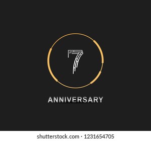 7 anniversary template with silver number and golden ring isolated on black background