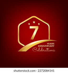 7 years anniversary inside of gold hexagon and curve with red backgrounds