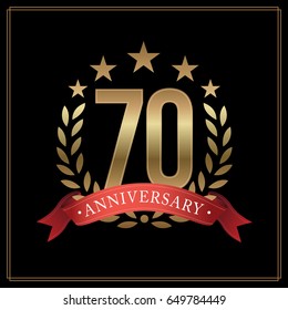 70 years golden anniversary logo, with star, red ribbon, and  laurel wreath isolated on black background, vector design