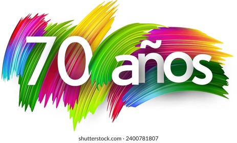 70 years at spanish paper word sign with colorful spectrum paint brush strokes over white. Vector illustration.