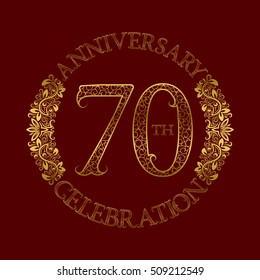 70th anniversary celebration vintage patterned logo symbol. Golden circular ornate emblem on red.