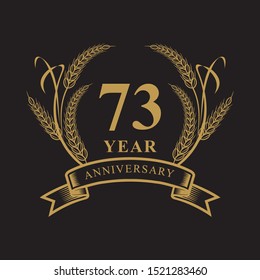 73 golden anniversary logo with ring and ribbon, laurel wreath vector design isolated on black background