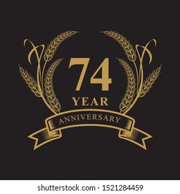 74 golden anniversary logo with ring and ribbon, laurel wreath vector design isolated on black background