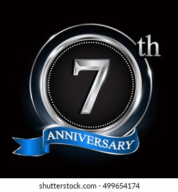 7th anniversary logo with silver ring and blue ribbon.
