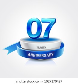 7th years blue anniversary logo celebration with ring and ribbon.