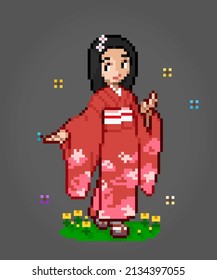 8 Bit Pixels Character Women Wear a Kimono Dress. Adult girl pixels in vector illustrations for game assets or cross stitch patterns.
