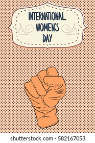 8 March, International Women's Day. Fist in glove raised up. 