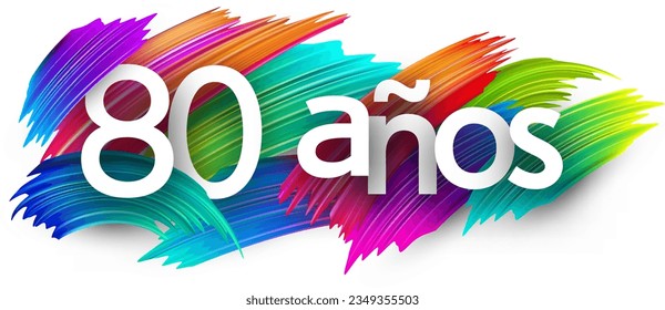 80 years at spanish paper word sign with colorful spectrum paint brush strokes over white. Vector illustration.