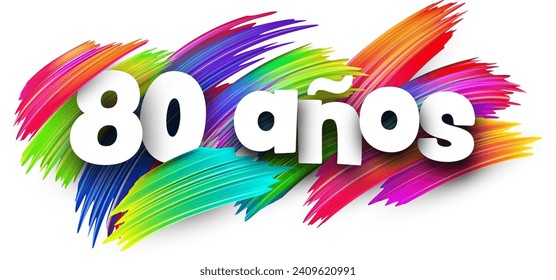 80 years at spanish paper word sign with colorful spectrum paint brush strokes over white. Vector illustration.