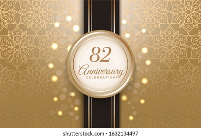 82 Anniversary celebration with luxury golden circle frame and pattern background.