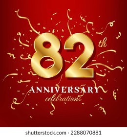 82 golden numbers and anniversary celebrating text with golden confetti spread on a red background
