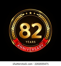 82 years anniversary, golden anniversary celebration logotype with red ribbon isolated on black background, vector illustration