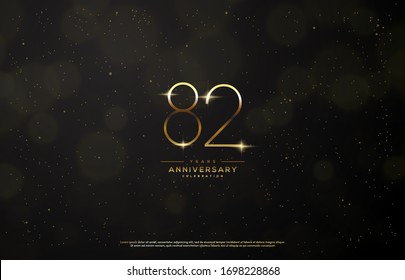 82nd anniversary background with an illustration of golden figures there is a ray of light in front of a black background.