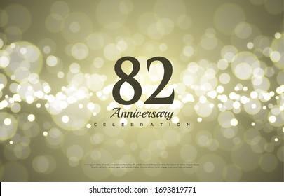 82nd anniversary background with illustrations of black numbers with golden light behind,