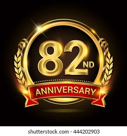 82nd golden anniversary logo, with shiny ring and red ribbon, laurel wreath isolated on black background, vector design