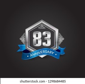83 years anniversary logotype design with blue ribbon, silver hexagon, and ornament isolated on dark background. Vector template for celebration company event, greeting card, and invitation card
