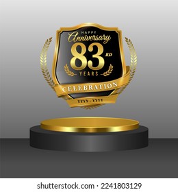 83 years gold anniversary celebration logo with 3d golden cylinder podium , isolated on grey background