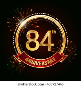 84th anniversary logo golden colored using ring, red ribbon, and fireworks background