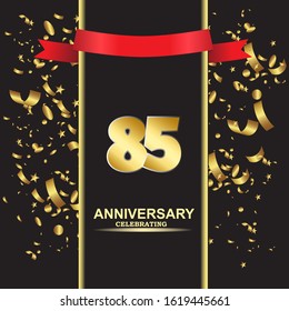 85 anniversary logo with confetti golden colored and red ribbon isolated on black background, vector design for greeting card and invitation card