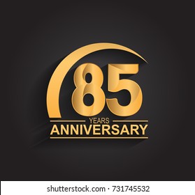 85 years anniversary celebration. Anniversary logo with swoosh and elegance golden color isolated on black background, vector design for celebration, invitation card, and greeting card