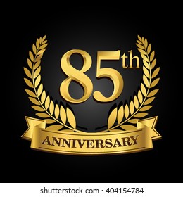 85th golden anniversary logo with ring and ribbon, laurel wreath vector design isolated on black background
