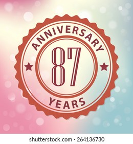 "87 Years Anniversary" - Retro style seal, with colorful bokeh background EPS 10 vector 