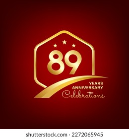 89 years anniversary inside of gold hexagon and curve with red backgrounds