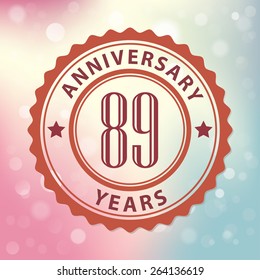 "89 Years Anniversary" - Retro style seal, with colorful bokeh background EPS 10 vector 