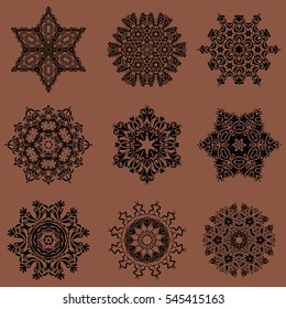9 snowflakes set on a brown background. Hand drawn design with abstract winter doodles. Vector Merry Christmas and Happy New Year lettering quote.